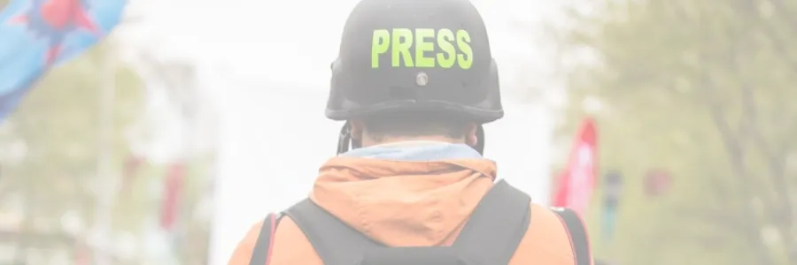 Photo of person in helmet labeled Press